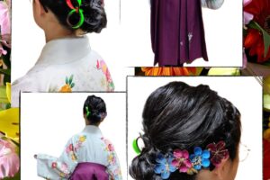 小学校の卒業式を迎えたお嬢様の袴姿。白地に鮮やかな花柄の着物と濃いピンクの袴（花の飾り付き）。ヘアセットはアップスタイルで、モダンなリボンや色とりどりの花の髪飾りを添えて。出張着付けヘアメイクめいりんや。